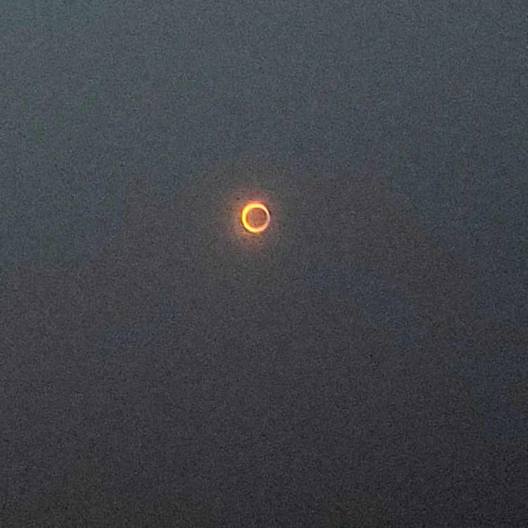 Annular eclipse, seen through sun watching procection glasses, captured with my phone.
