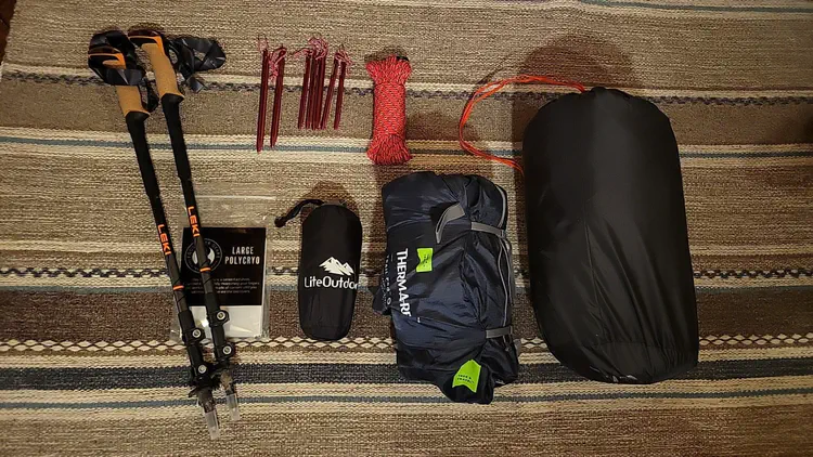 Preparing some gear for backpacking. I bought trekking poles, a backpack, and an ultra-light tarp for shelter.