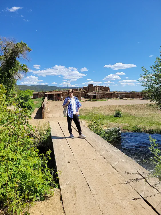 Taos Pueblo — Me on a bridge.