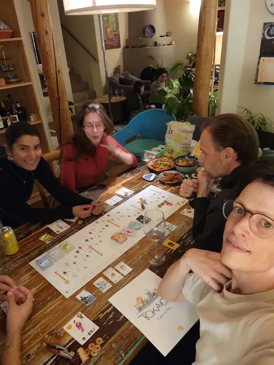 Playing Tokaido, a game in which travellers go on a journey to Edo.