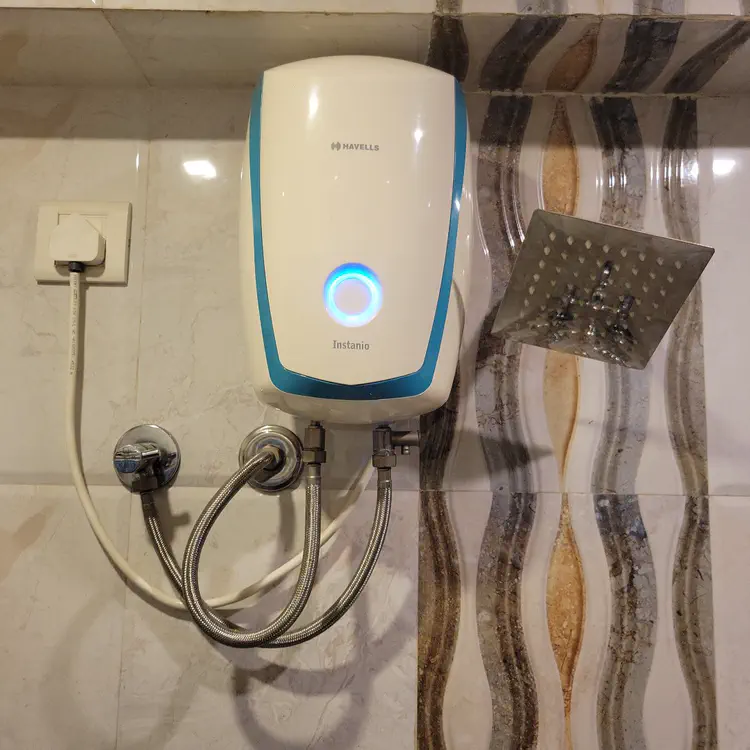 Instant water heater near the shower. There is no hot water tank.