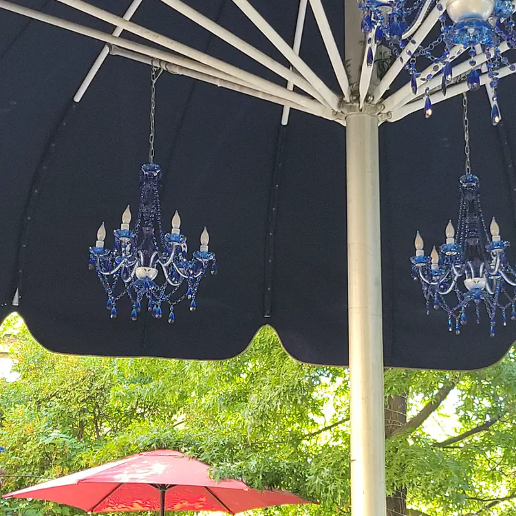 Chandeliers at a restaurant terrace.