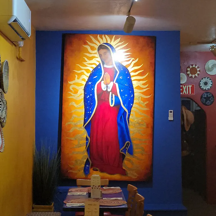 Lady Guadelupe painting in a Mexican restaurant.