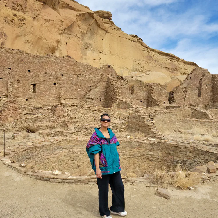 Riya in front of a kiva