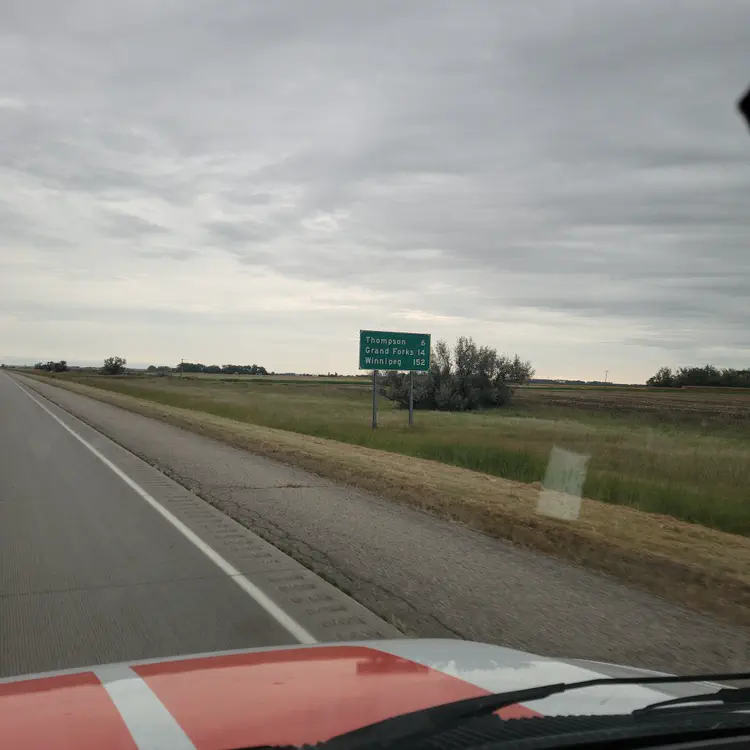 North Dakota. First appearance of Winnipeg on mileage signs.
