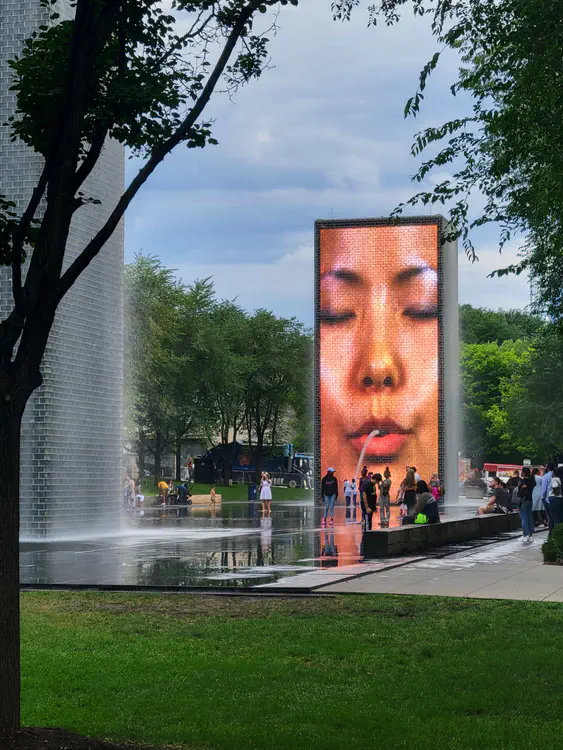 The interactive fountains contain LCD panels displaying videos of people's faces spewing water on visitors.