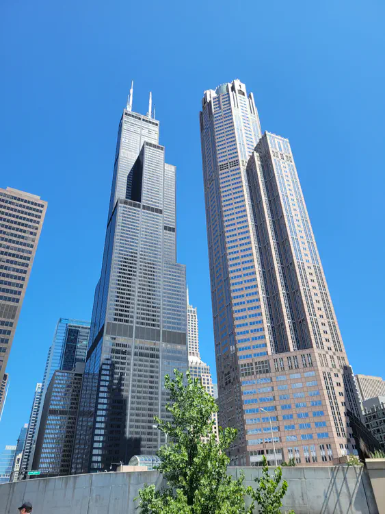 The building on the right is half the size, but appears as high as Willis tower due to perspective.