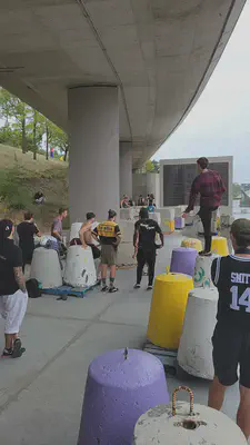 Moving under an overpass because of the rain.