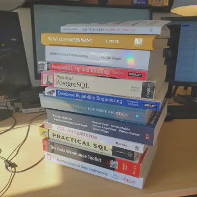 Books on data engineering, PostgreSQL, Event Modeling, and Jobs-to-be-done.